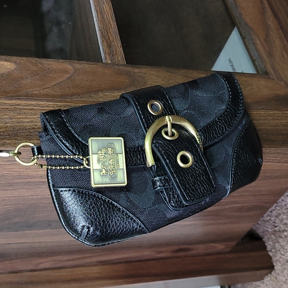 - Coach wristlet black super cute large enough for phone. - Picture 2 of 16